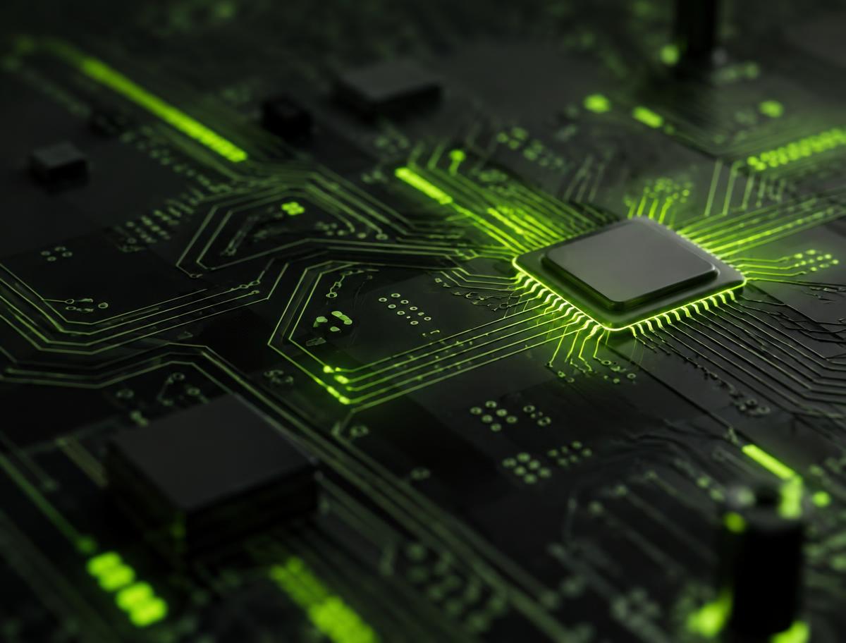 Macro view of a circuit board with a processor and glowing green traces